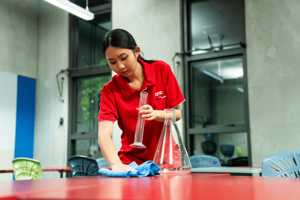 amc cleaner in uniform specialised school cleaning in New Zealand.