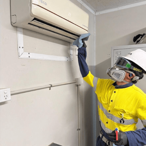 AMC commercial cleaning Professional cleaner in protective gear ensuring safe operations at a New Zealand industrial site