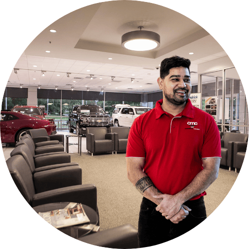 amc cleaner in uniform standing at dealership site in auckland new zealand
